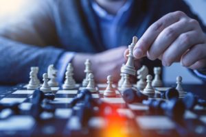 man playing chess: an analogy of exit strategizing